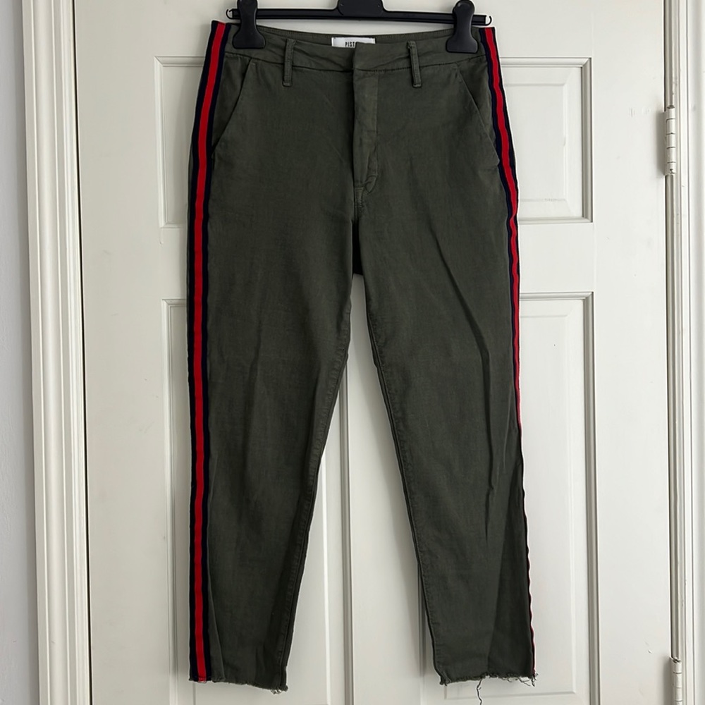 Pistola army green pants with red stripe lining on the sides.